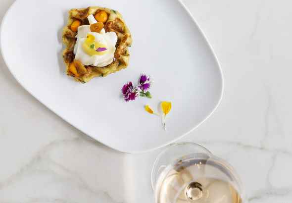Cod waffle with its flakes and parsley and garlic air